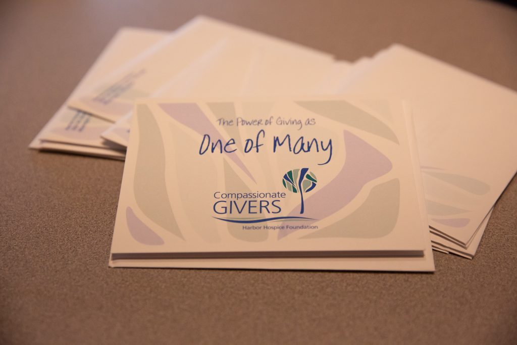 Compassionate Givers card that says "the power of giving as one of many"