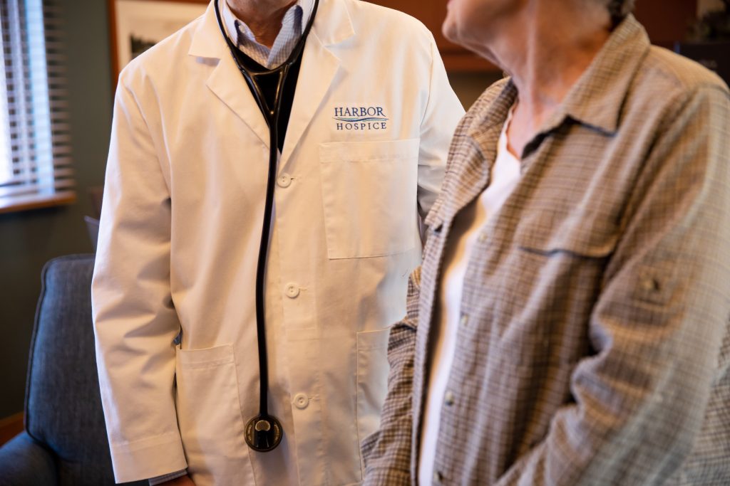 Harbor Hospice doctor talks with a Harbor Hospice patient