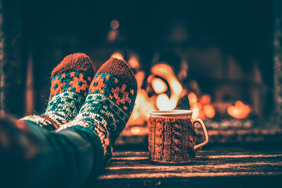 holiday socks & coffee mug by the fireplace